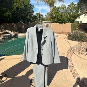 Women’s gray professional pants suit with side zip.